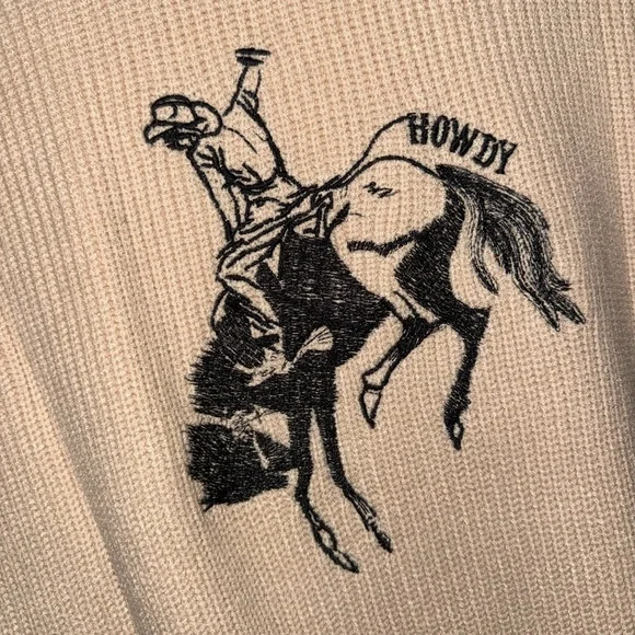 Women’s Cream Sleeveless Sweater with Cowboy Graphic - Picture 2 of 2